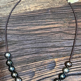 Tahitian pearls on braided dark brown leather 21''